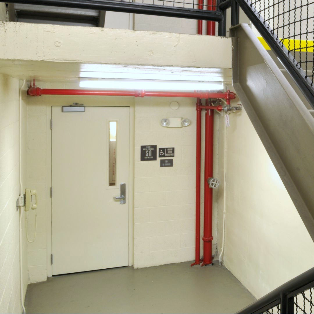 A white fire-rated steel door
